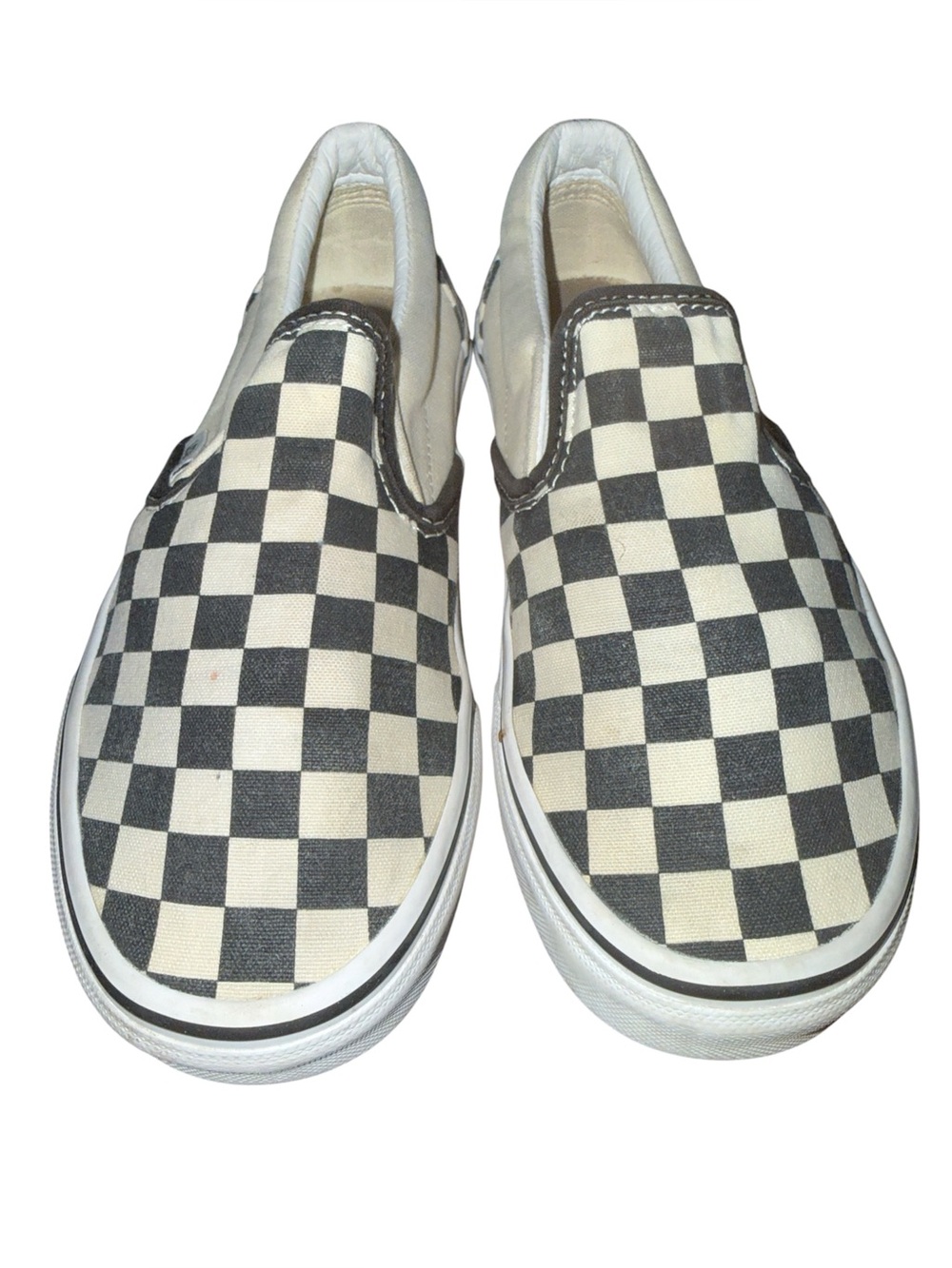 Vans Classic Slip-On Checkerboard sneakers, featuring a timeless black-and-w